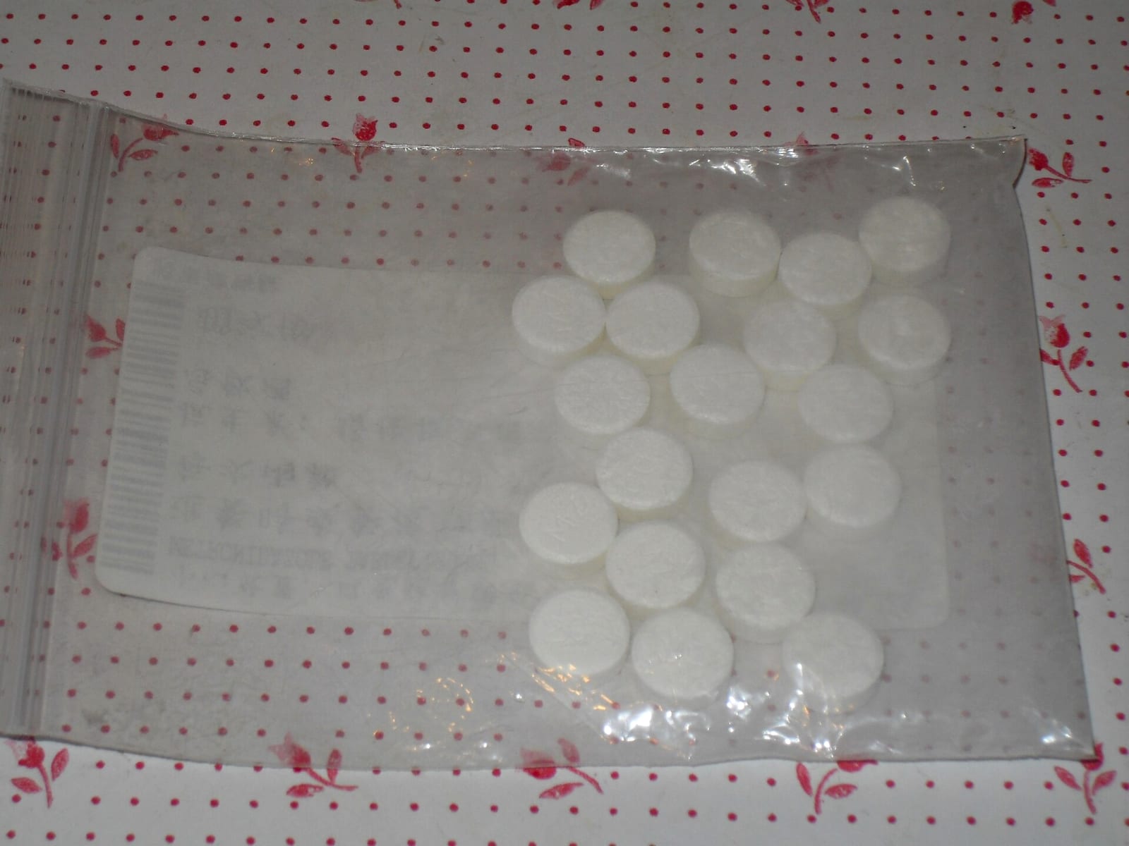 A pharmacy pack of generic metronidazole tablets in a clear blister card, with dosing instructions printed on the label.